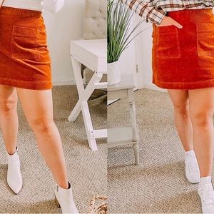 New with tags free assembly skirt size large. Corduroy and a burnt orange color.